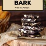 Pieces of dark chocolate bark on a parchment paper.
