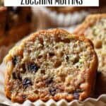 A chocolate chip zucchini muffin cut in half showing its tender texture.