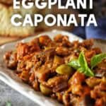 Eggplant caponata on a white serving dish.