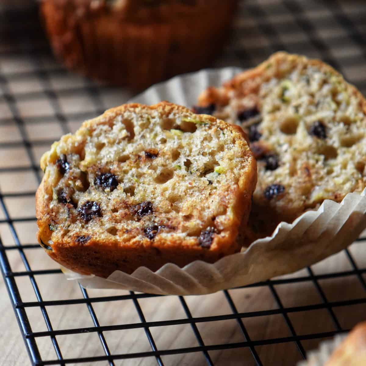 The soft and tender texture of the interior of a chocolate chip zucchini muffin.