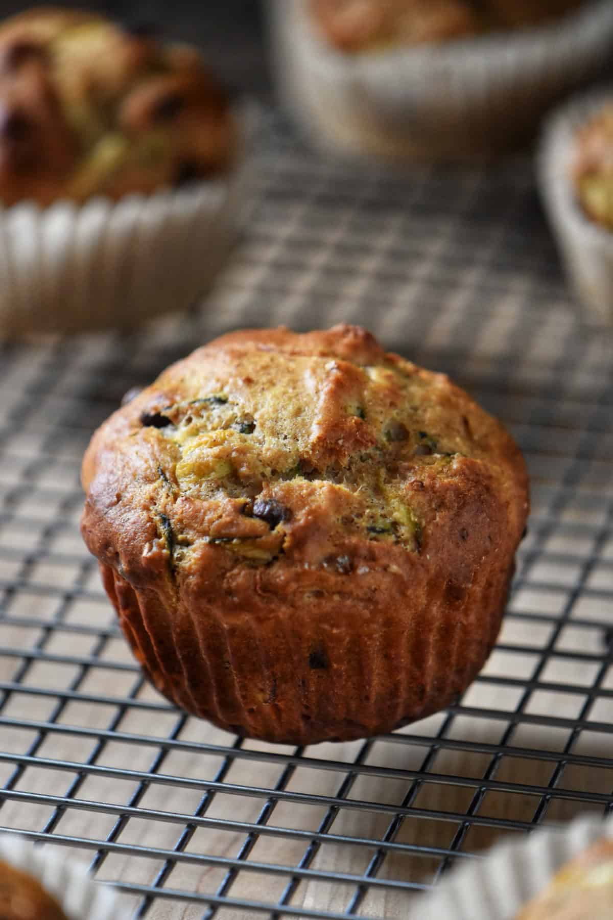 Zucchini muffins on a cooling rack.