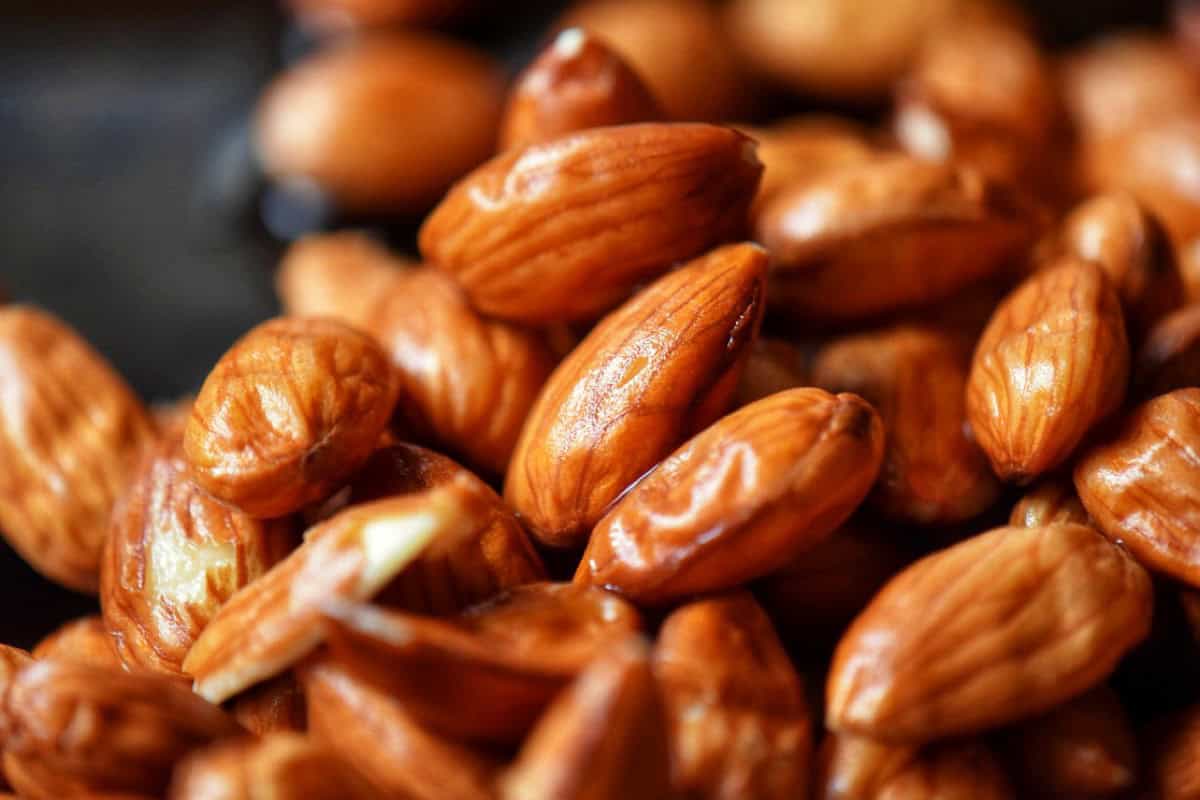 Close up of the wrinkled skins of almonds.