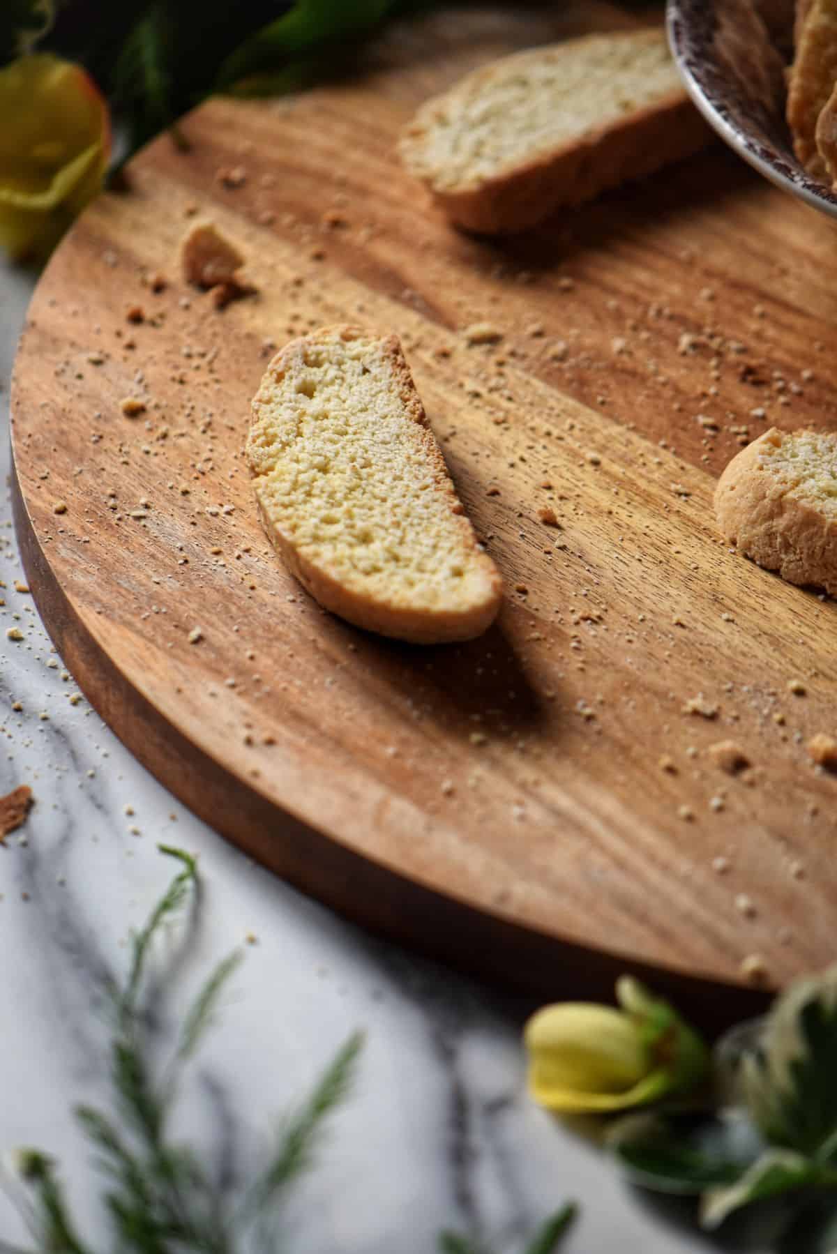 A lemon biscotti on a wooden board.