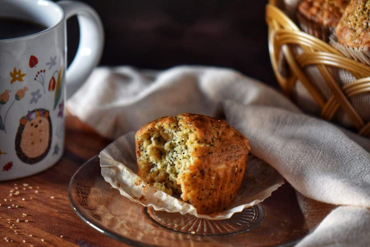 A Buttermilk Oatmeal Muffin is split open to reveal a tender crumb.