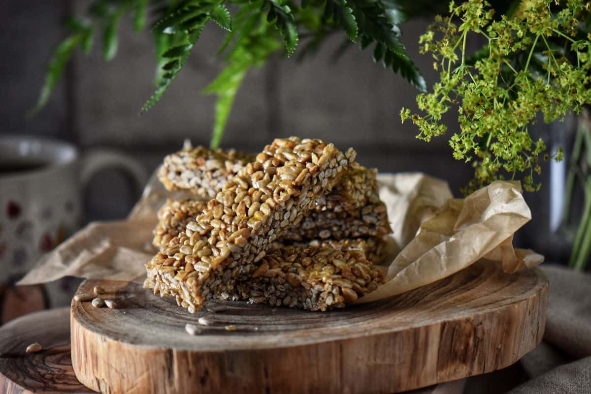 Rectangle pieces of sesame candy on a wooden board.