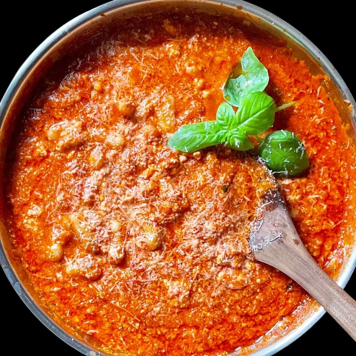 An overhead photo of pasta with tomato ricotta sauce.