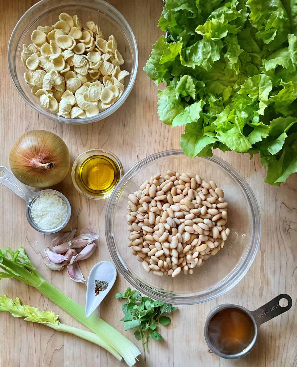 Ingredients to make pasta with white beans and escarole.