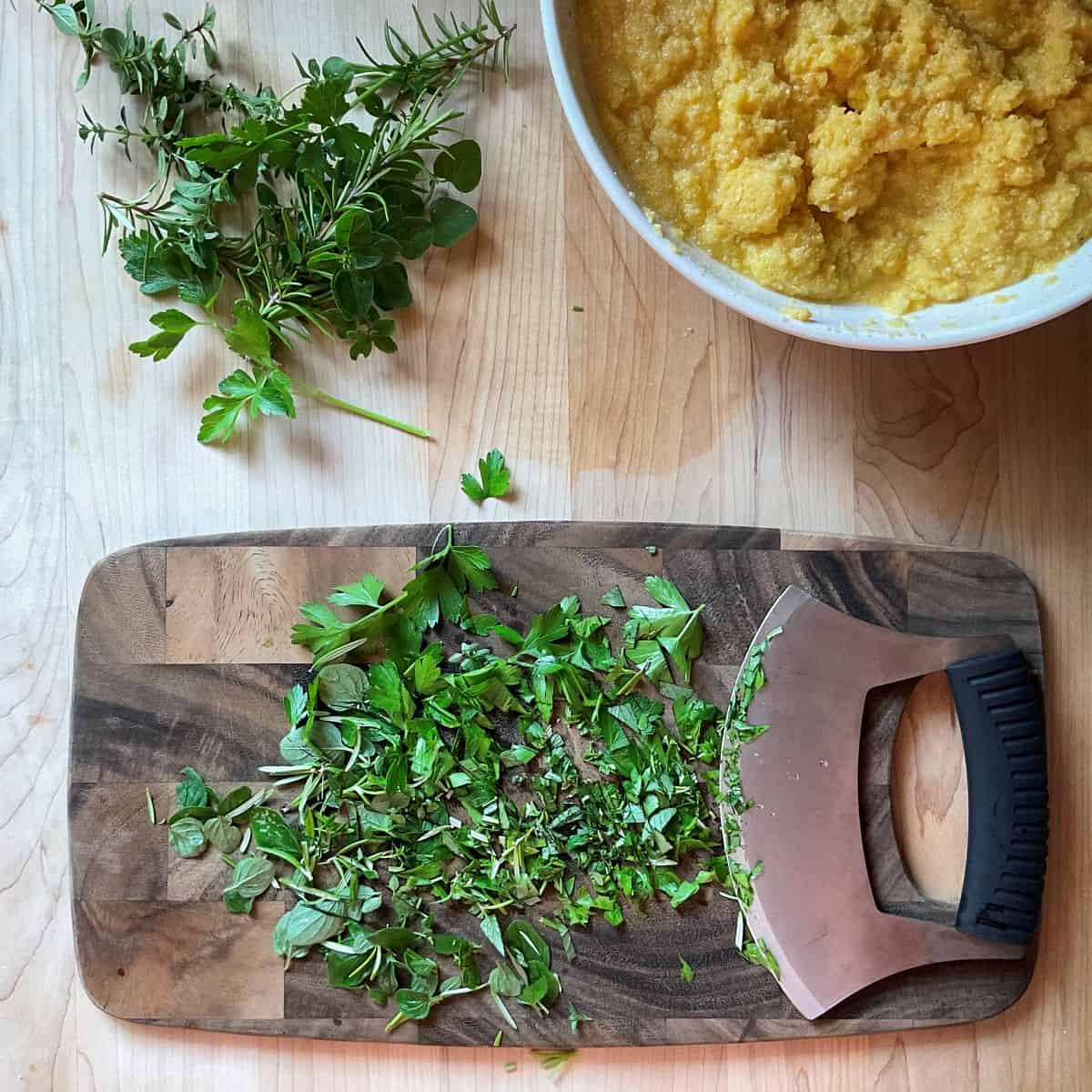 Fresh herbs on a cutting board.