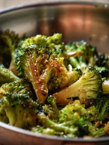 Skillet broccoli garnished with toasted sesame seeds.