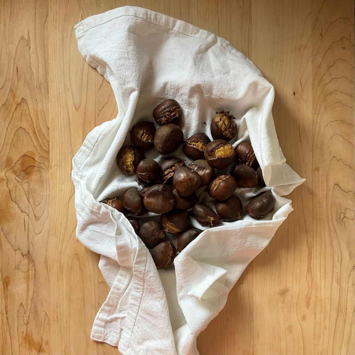 Roasted chestnuts in a tea towel.