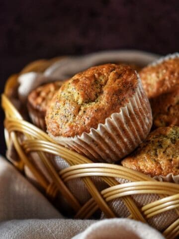 Lemon poppy seed muffins with buttermilk in a wicker basket.