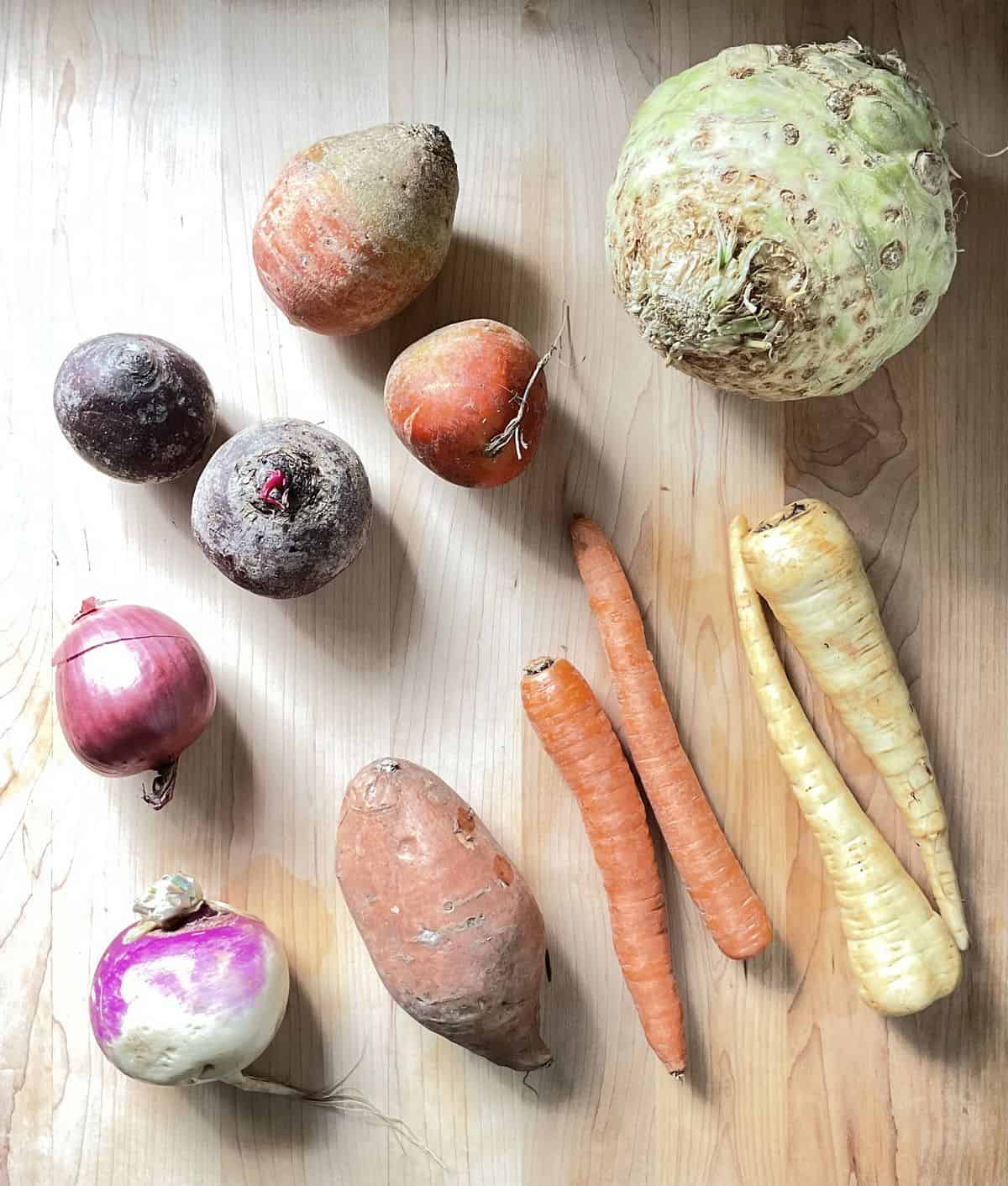Root vegetables on a wooden board.