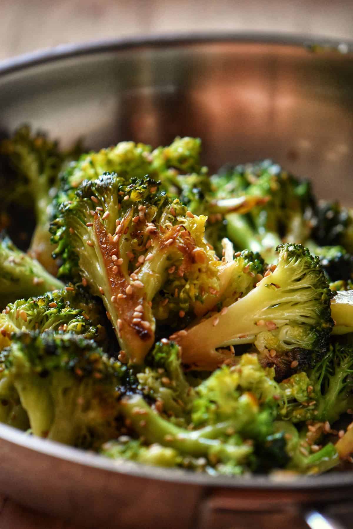 Skillet broccoli garnished with toasted sesame seeds.