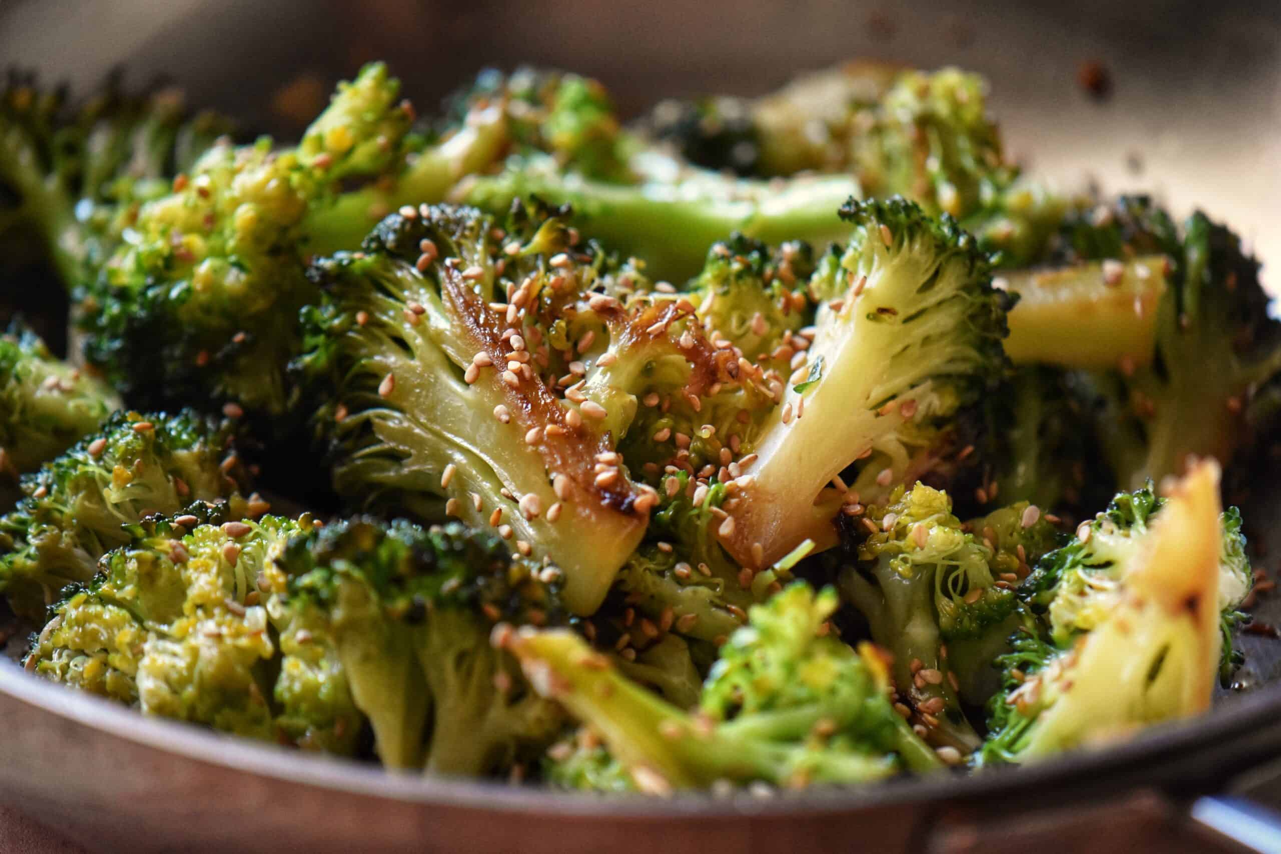 Pan fried broccoli garnished with toasted sesame seeds.