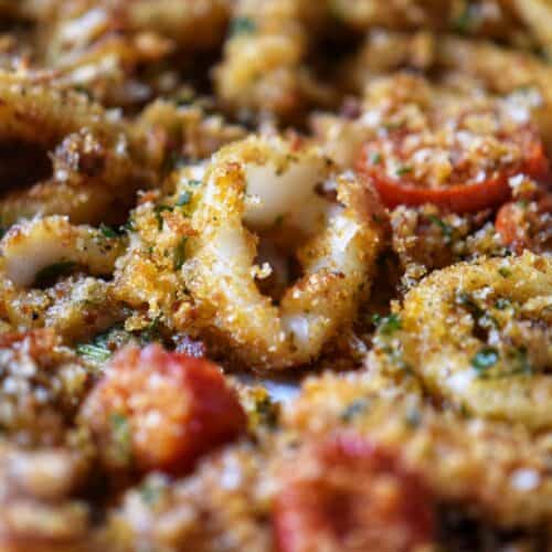 Baked calamari with homemade bread crumbs and cherry tomatoes.