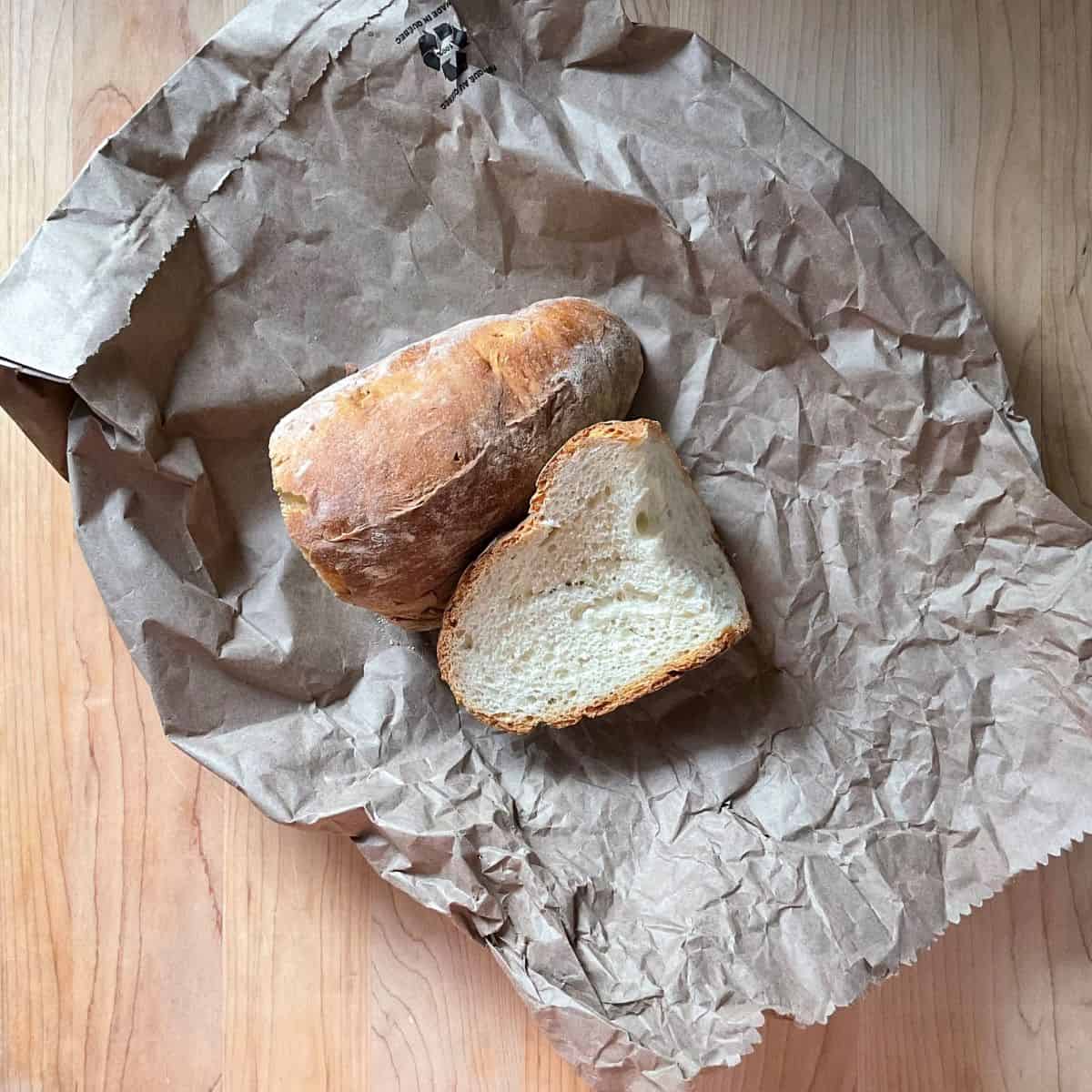 Stale bread on a brown paper bread bag.