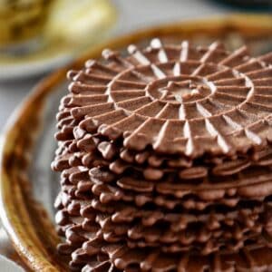 A stack of chocolate pizzelle.