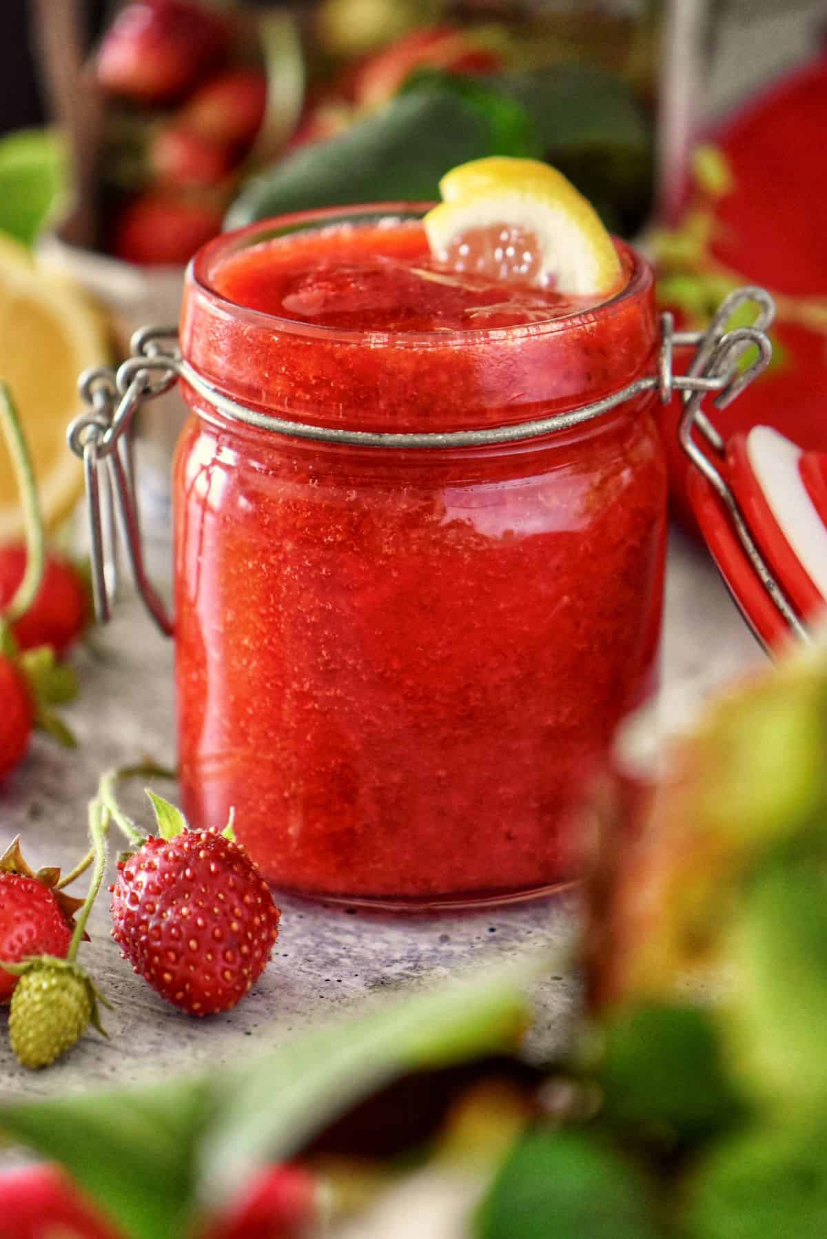 A Mason jar of strawberry compote.
