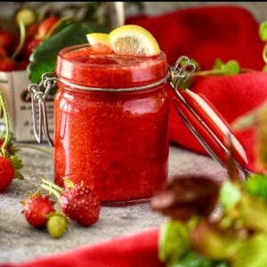 A Mason jar of strawberry compote.