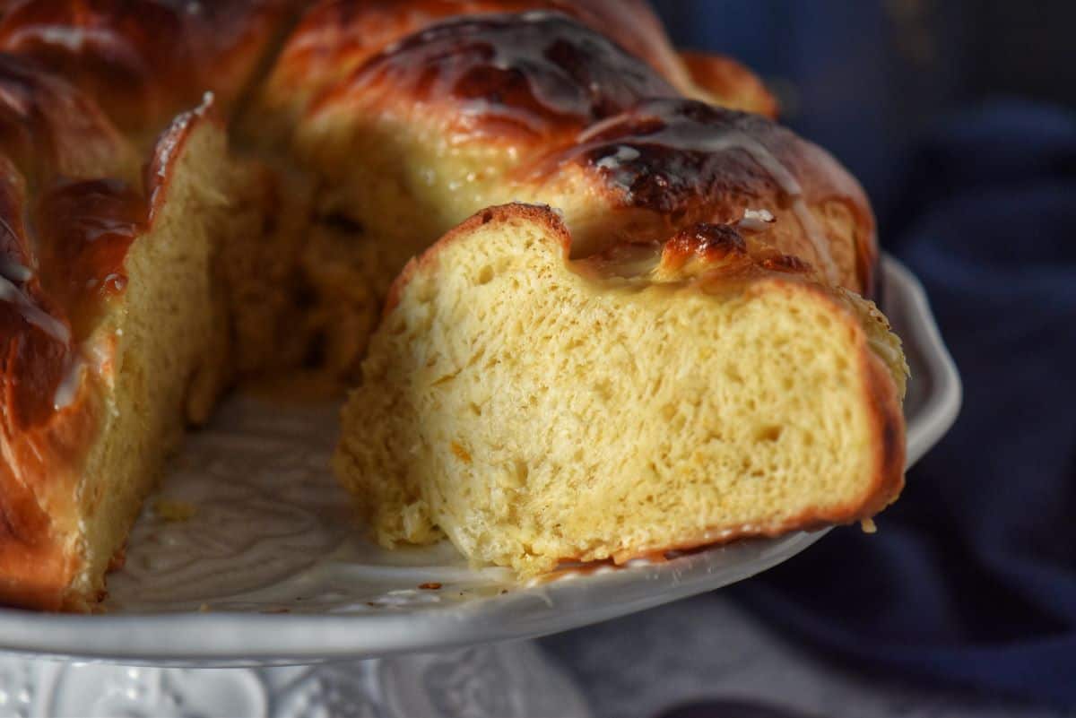 The soft interior of an orange coffee cake with ricotta.