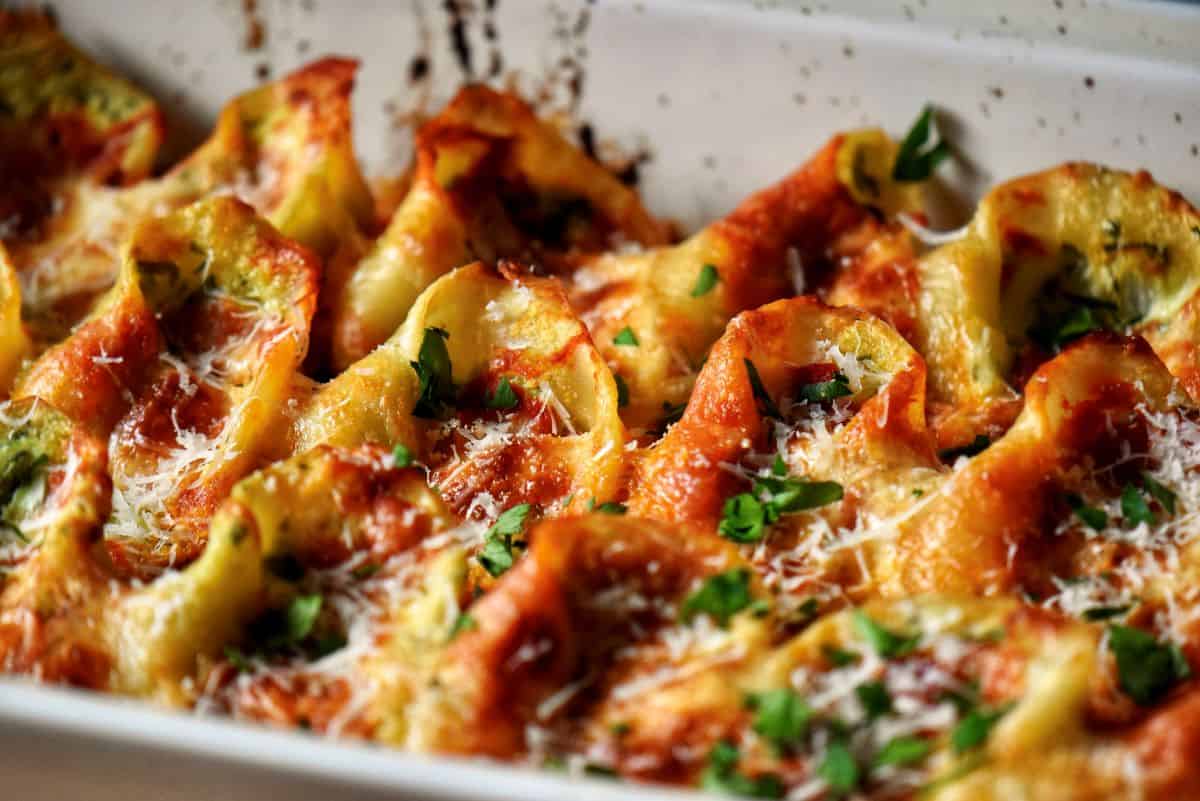 Stuffed pasta with ricotta and spinach in a baking dish. 