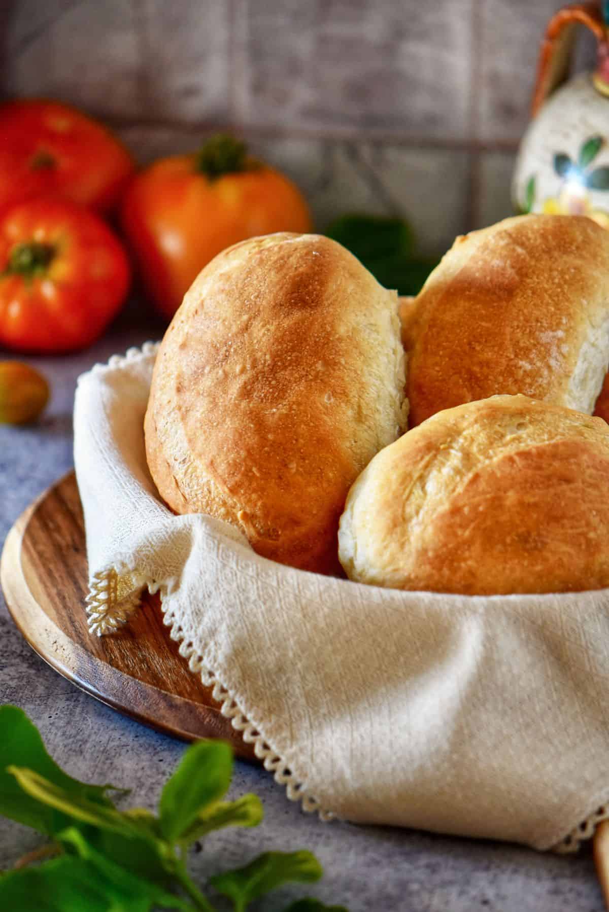 Freshly baked Italian panini bread in a basket.