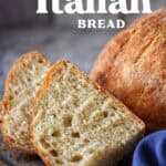Sliced rustic Italian round bread showing the fluffy and airy texture.
