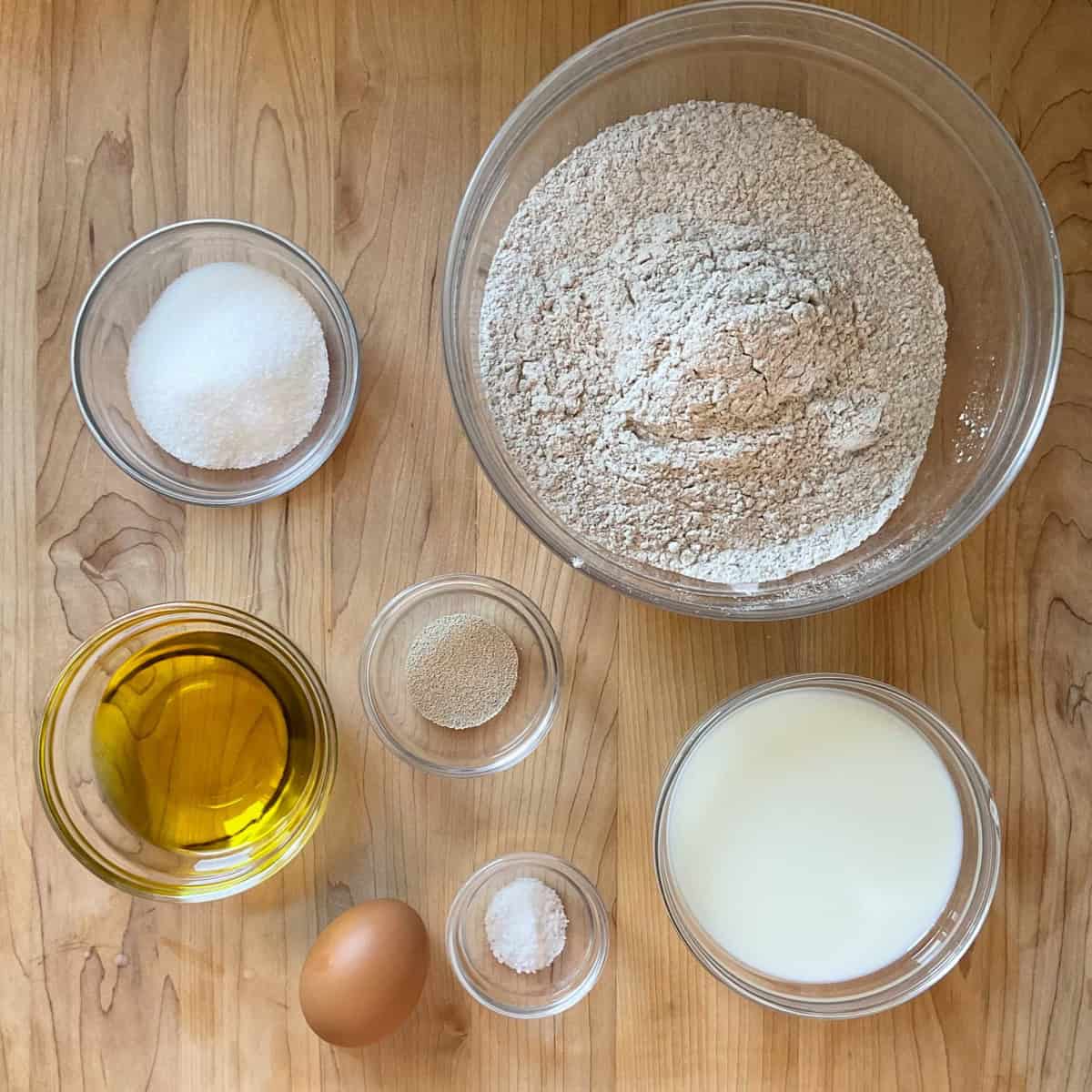 Measured ingredients on a wooden table to make fette biscottate.