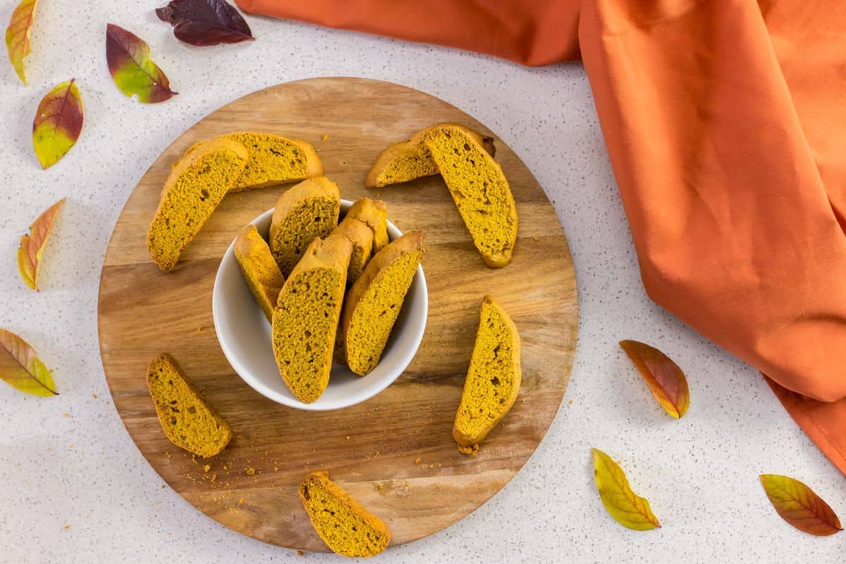 Pumpkin biscotti in a white bowl.