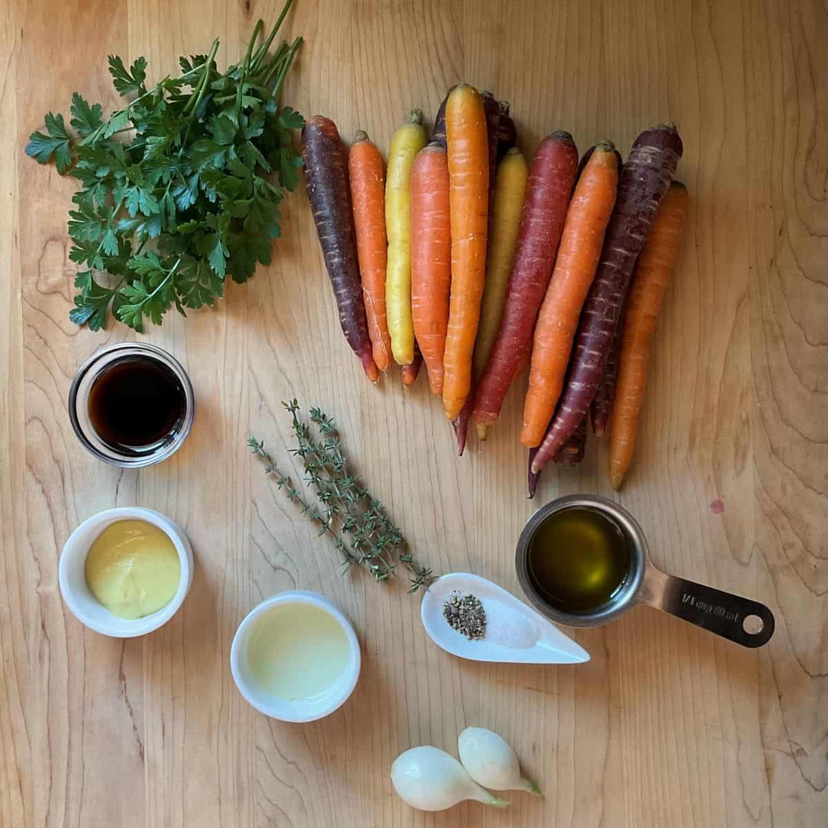 Overhead view of simple ingredients for roasted rainbow carrots with balsamic vinaigrette.