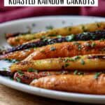 Oven roasted rainbow carrots garnished with fresh parsley, ready to serve.