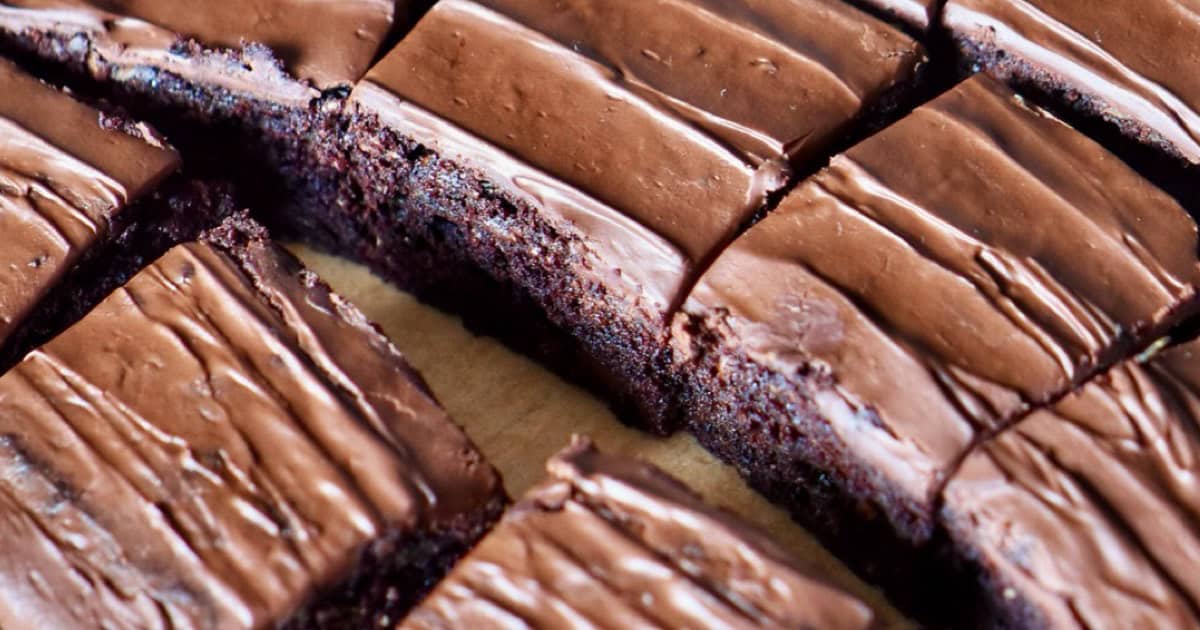 Portioned vegan brownies in a pan.