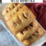 Fresh baked apple hand pies with golden egg wash finish and coarse sugar cinnamon topping.