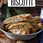 Crunchy Italian orange biscotti with pecans stacked in a bowl, ready to enjoy with coffee.