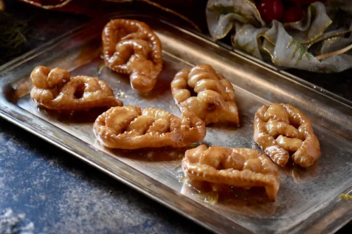 Italian Christmas cookies on a silver serving platter.