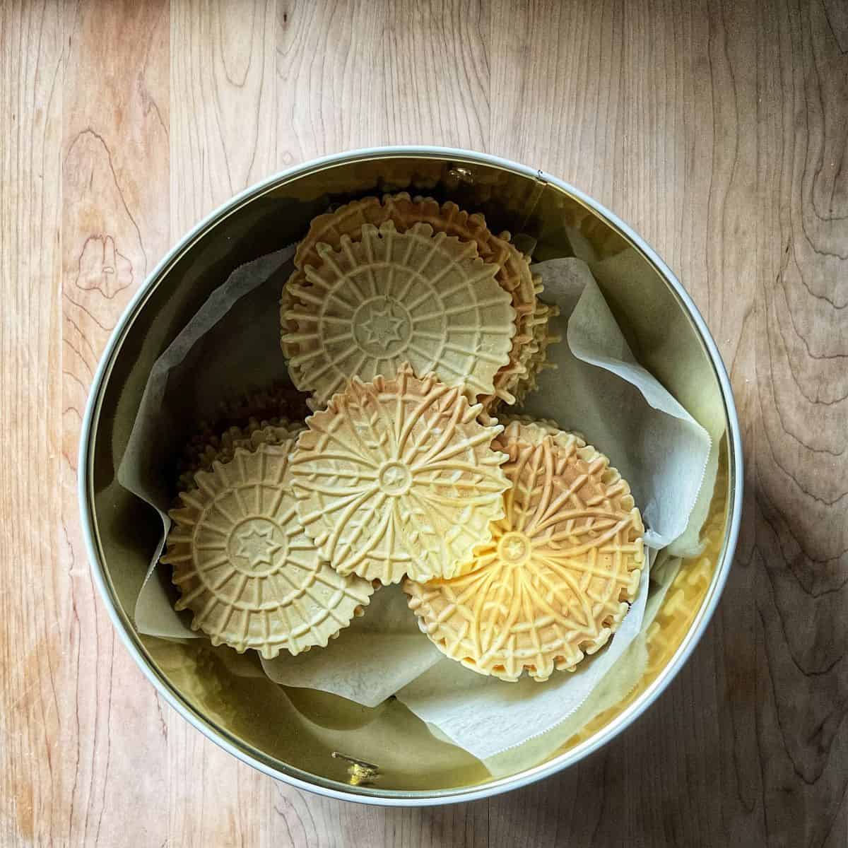 Tin canister filled with homemade lemon pizzelle.
