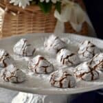 Chocolate amaretti cookies on a white platter